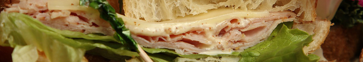 Eating Sandwich Bakery at Cinotti's Bakery-Sandwich Shop restaurant in Jacksonville Beach, FL.